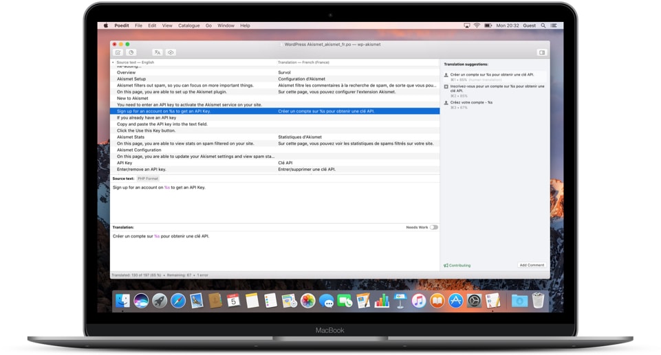 Poedit translation editor displayed on a MacBook Pro